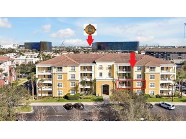 Beautiful multi-Gathering building featuring a tile roof, well-kept landscaping, and ample parking spaces at 5025 Shoreway Loop # 20503, Orlando, FL 32819