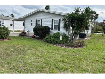 Charming single-story home with well-maintained landscaping and attractive curb appeal at 103 Dreama Dr, Davenport, FL 33897