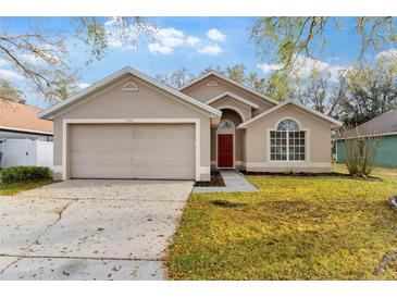 Charming single Gathering home featuring a two-car garage and a well maintained lawn at 113 Glasgow Ct, Davenport, FL 33897