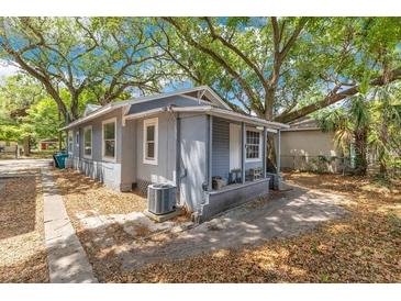 Charming single-story home with mature trees and well-maintained landscaping at 1029 Colyer St, Orlando, FL 32805