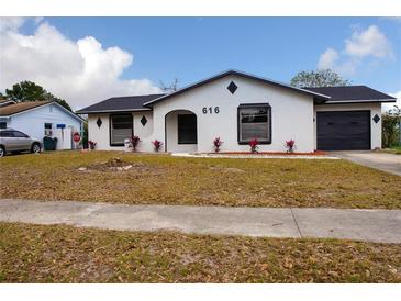 Charming single-story home with a well-manicured front yard and an attached single car garage at 616 Ivanhoe Way, Casselberry, FL 32707