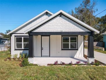 Charming craftsman home with black framed windows and inviting front porch at 1112 W Line St, Leesburg, FL 34748