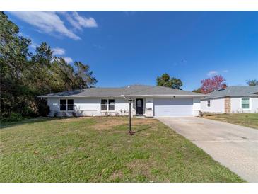 Charming single-story home featuring a well-maintained lawn and inviting curb appeal at 820 Rayston, Deltona, FL 32725