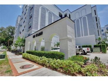 Beautiful exterior of building featuring manicured landscaping and ample parking space at 206 E South St # 4031, Orlando, FL 32801