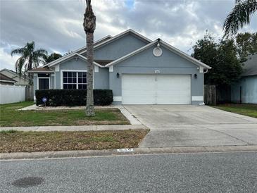 Charming single-story home featuring a two-car garage and well-maintained front yard at 636 Bohannon Blvd, Orlando, FL 32824