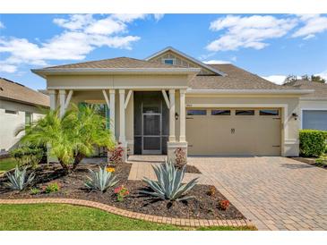 Charming single-story home with a well-manicured lawn and attractive desert-style landscaping at 1905 Estuary Ln, Kissimmee, FL 34747