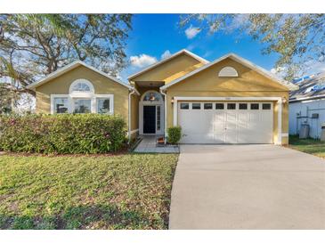 Charming single Gathering home featuring an attached garage and a well manicured lawn in a desirable neighborhood at 3001 Bellingham Dr, Orlando, FL 32825