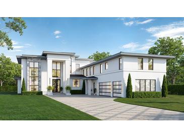 Stunning modern home showcasing its crisp white exterior, large windows, and meticulously manicured lawn at 10433 Trout Rd, Orlando, FL 32836