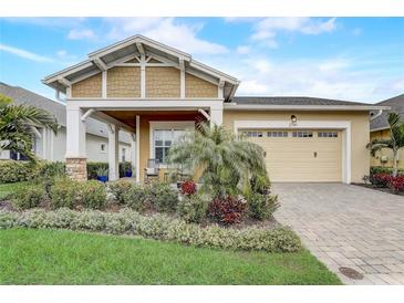 Charming single-story home with a well-manicured lawn and a welcoming front porch at 2741 Southland St, St Cloud, FL 34772
