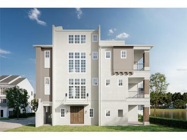 Stunning three-story home boasting large windows and a waterside view at 8517 Karrer Ter, Orlando, FL 32827