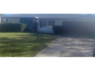 Charming single-story home with a well-maintained lawn and covered entry at 759 Swallow St, Deltona, FL 32725