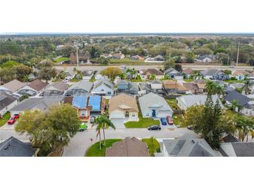 Neighborhood aerial view showcasing the community layout, streets, and nearby amenities at 458 Hollinghead Loop, Davenport, FL 33896