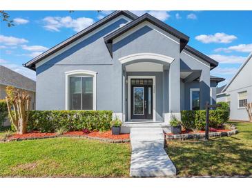 Charming single Gathering home with a well maintained lawn and a welcoming front entrance at 3320 Ashmount Dr, Orlando, FL 32828