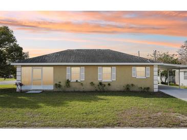 Charming single-story home featuring a well-maintained lawn and covered parking at 4431 Clubhouse Rd, Lakeland, FL 33812