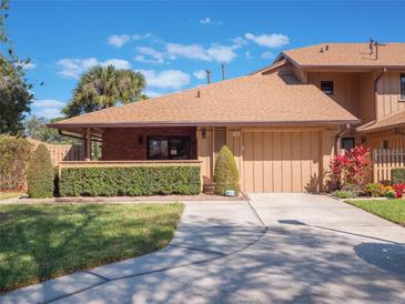 Charming single-story home with a well-manicured lawn and inviting curb appeal at 193 Heron Bay Cir # 8, Lake Mary, FL 32746