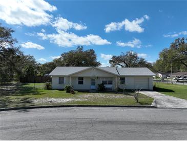 Charming single Gathering home featuring a classic design, attached garage, and a well-maintained front yard at 820 Dove Ridge Dr, Lakeland, FL 33803