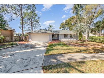 Charming single-story home featuring a two-car garage, mature trees, and a well-maintained front yard at 184 Dublin Dr, Lake Mary, FL 32746