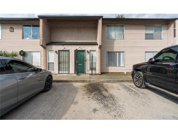 Cozy two-story townhome with a private entrance, parking space, and traditional architectural design at 4004 Barwood Dr # 3804, Orlando, FL 32839