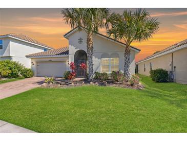 Charming single-story home with well-manicured lawn and mature palm trees in a warm, inviting setting at 1330 Bucktail Ct, Kissimmee, FL 34746