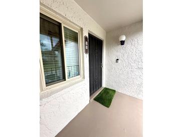 Welcome to this cozy condo, with a charming front entrance and secure metal security door at 9 Escondido Cir # 88, Altamonte Springs, FL 32701