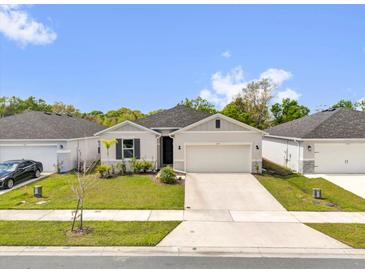Charming single-story home featuring a well-maintained lawn and a paved two car driveway at 3771 Whitetail Ct, St Cloud, FL 34772