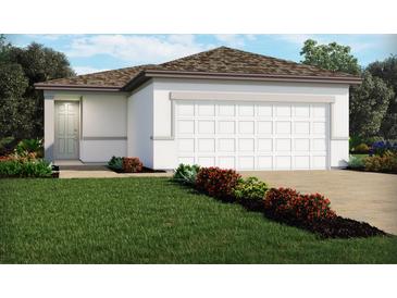 Charming single-story home with a manicured lawn and two car garage at 4002 Copperleaf Ln, Poinciana, FL 34759