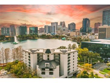 Stunning exterior view overlooking Lake Eola, capturing both the building and the vibrant Orlando skyline at sunset at 401 E Robinson St # 101, Orlando, FL 32801