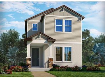 Charming two-story home with neutral siding, stone accents, and professionally landscaped front yard at 5093 Railroad Vine Aly, Winter Garden, FL 34787