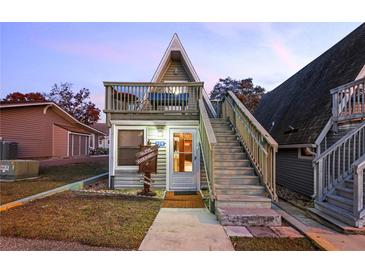 Charming A-frame cottage with a cozy balcony, wooden stairs and a unique 