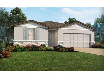 Charming single-story home with a two-car garage, landscaping, and a combination of stone and gray siding at 5150 Minneola Ln, St Cloud, FL 34772