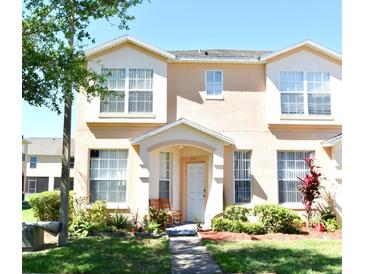 Charming townhouse with a well-manicured front yard and covered entryway at 643 Captiva Cir, Kissimmee, FL 34741