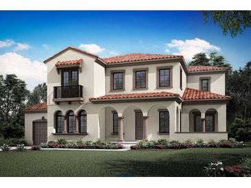 Inviting two-story home featuring a red tile roof, arched entryway, and charming balcony at 2331 Celebration Blvd, Celebration, FL 34747