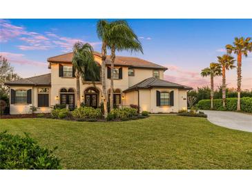 Stunning two-story home with lush landscaping and a paver driveway at 3123 Bentonshire Pl, Longwood, FL 32779