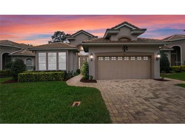 Charming home featuring a manicured lawn and a two-car garage, perfect for suburban living at 501 Sotheby Way, Debary, FL 32713