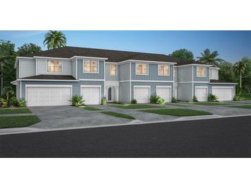 New construction townhomes featuring attached garages and eye-catching curb appeal at 1713 Delightful Dr, Davenport, FL 33896