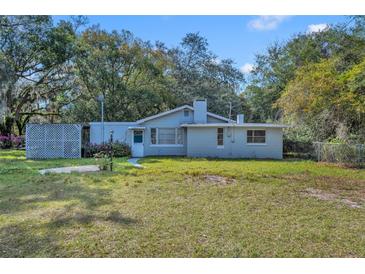 Charming single-story home with a quaint front yard and mature trees providing ample shade at 3508 Rouse Rd, Orlando, FL 32817