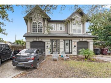 Charming townhouse with a well-manicured lawn and two-car garage at 3007 E Central Blvd # 3007, Orlando, FL 32803