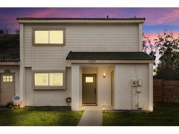 Charming two-story townhome features a well-maintained lawn and covered front entryway at 1269 Winter Green Way, Winter Garden, FL 34787