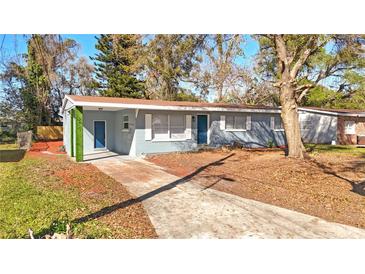 Charming single-story home featuring a well-kept lawn and driveway leading up to the front entrance at 3627 Arch St, Orlando, FL 32808