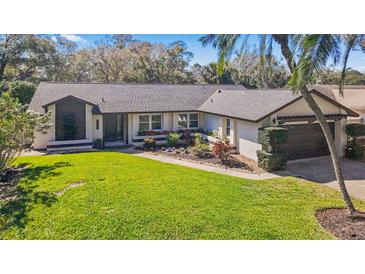 Charming single Gathering home with a well-manicured lawn and beautiful landscaping at 5140 Honeynut Ln, Windermere, FL 34786