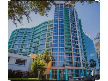 Modern high-rise condo building featuring a distinctive design and a vibrant color scheme at 322 E Central Blvd # 1805, Orlando, FL 32801