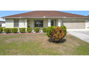 Charming single-story home with a well-maintained lawn and a two-car garage at 5361 Se 92Nd St, Ocala, FL 34480