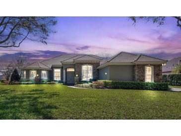 Lovely single story home with lush front lawn and manicured landscaping at 12848 Jacob Grace Ct, Windermere, FL 34786
