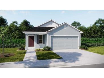 Charming single-story home with a two-car garage and well-maintained lawn at 3856 Bluethread Way, Poinciana, FL 34759
