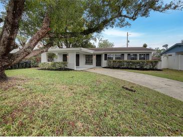 Charming single-story home with a well-manicured front yard and inviting curb appeal at 4561 Evers Pl, Orlando, FL 32811