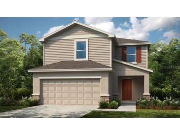 Charming two-story home with neutral siding, a two-car garage, and well-maintained landscaping at 7355 Capstone Dr, Groveland, FL 34736