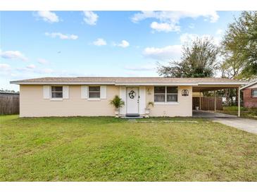 Charming single-story home with a well-maintained lawn and a convenient carport at 2260 Danforth Ave, Deltona, FL 32738