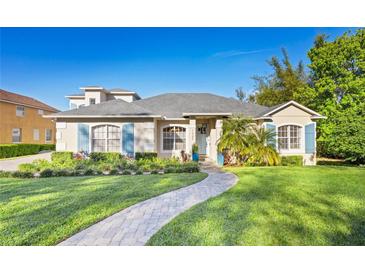 Charming single-story home with a well-manicured lawn and inviting walkway at 1320 Myrtle Dr, Longwood, FL 32750