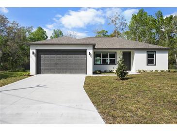 Charming single-story home featuring a two-car garage and newly landscaped front yard at 4470 Frances Ave, Sanford, FL 32773