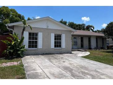 Charming single-story home featuring a spacious driveway and well-maintained front yard at 131 San Blas Ave, Kissimmee, FL 34743